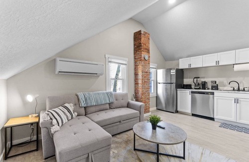 West Central Apartment | Downtown Apt with Wooden Beams & Brick Accents