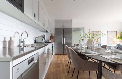 Bastad Condo | Earthy Ground Floor Home Patio Sunbeds Greenery