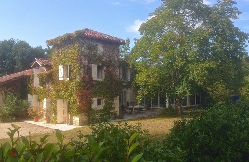 Lussan House | Enchanting stone farmhouse, pool, tennis court and several hectares of grounds.