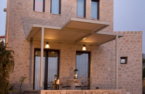 Stoupa Villa | Enjoy the relaxation of chic seaside living in a sea view stone villa