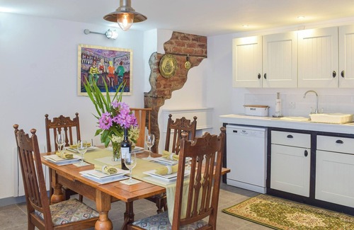 Kilcreggan Cottage | Enjoy the stunning loch views from the lounge or outdoor seating area.