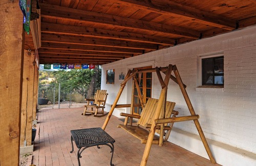 Tyrone Apartment | Enjoy Wildlife from Your Rocking Chair and Swinging Bench on Front Porch