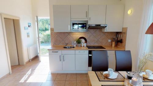 Pelzerhaken House | Feriendorf Südstrand Haus 03