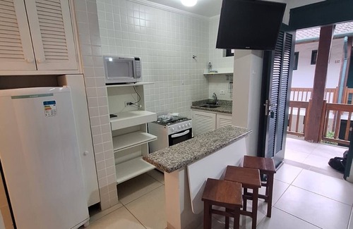 Praia do Pauba Apartment | Flat Praia de Pauba, right on the sand, heated pool, barbecue and sauna.