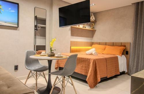 Jardim Oceania Apartment | Flat a 50m da praia, com cozinha, estacionamento, recepção 24h, academia, lavanderia, Wi-Fi, Rooftop com piscina, churrasqueira e vista incrível