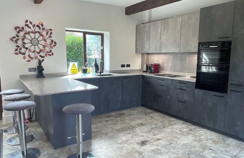Arundel House | Flint Barn in Arundel With Vaulted Lounge, Private Gardens, new Kitchen, Parking