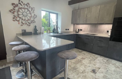 Arundel House | Flint Barn in Arundel With Vaulted Lounge, Private Gardens, new Kitchen, Parking