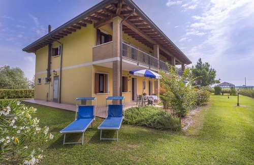 Palazzolo dello Stella Apartment | Folaghe 3, apartment with terrace overlooking the grove