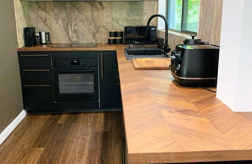 Carrara Apartment | Fully Self-contained Spacious Granny Flat/Pool House at Rear of Owner's Home.