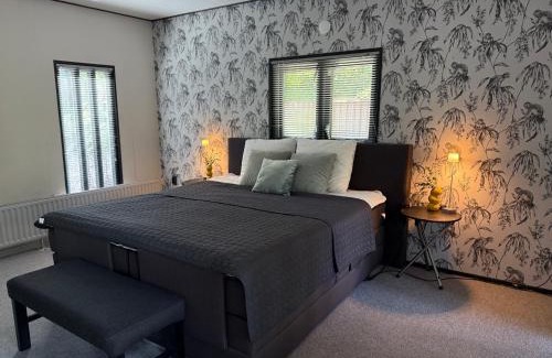 Erm House | Gezellig chalet met 2 slaapkamers aan bosrand