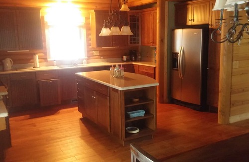 White Oak Cabin | Gorgeous lakefront log home on secluded cove with private beach and boat dock