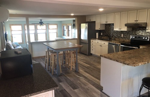 Rochert House | Gorgeous sunsets and a sugar sand beach in the heart of lakes country await you!