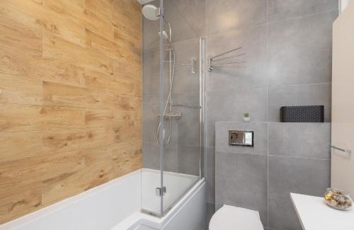 Sosnowiec Apartment | Ground Floor Apartment with Garden and FREE GARAGE in Sosnowiec by Noclegi Renters