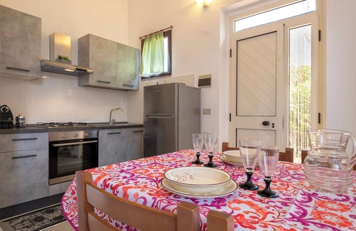 Trinita d'Agultu e Vignola House | Holiday Home 'Rose's House' with Lateral Sea View, Private Terrace and Private Garden