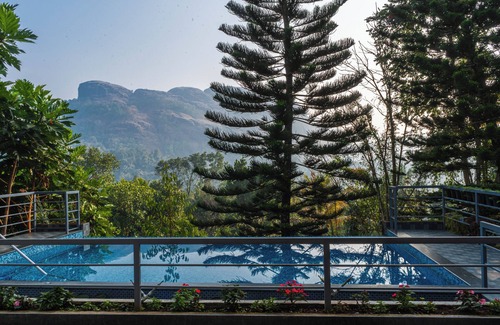 Devikolam House | Homestay with Serine Views, Pool, and delicious local food.