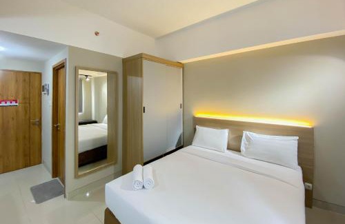 Duren Sawit Apartment | Homey and Well Furnished Studio Gateway Park LRT City Jatibening Apartment By Travelio
