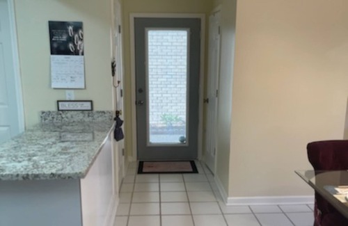 Destrehan House | Ideally located townhome with updated kitchen, patio, & W/D - dog-friendly