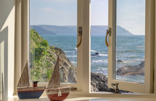 Portholland Cottage | In an exceptional position right on the beach is this spacious and comfortable cottage - a perfect g