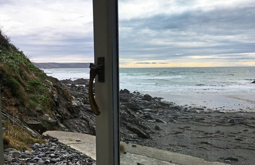 Portholland Cottage | In an exceptional position right on the beach is this spacious and comfortable cottage - a perfect g