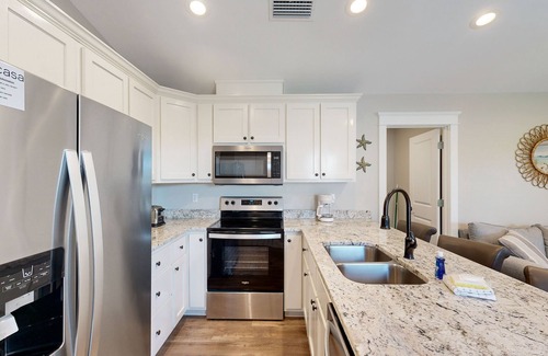 Dauphin Island House | Inviting home near the beach with balcony, full kitchen, central AC, & W/D