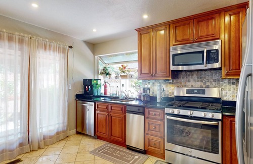 Fremont House | Inviting home with pool, fitness area, fireplace, & W/D