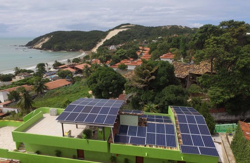 Ponta Negra Apartment | kitchenette with black tip with sea/beach view