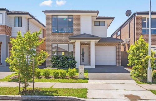 Austral House | KozyGuru | Austral | Charming 4Bedroom Family Home