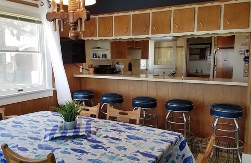 Gypsum House | Lake Front Nautical Themed Home with Private Yard & Sandy Bottom Water Access!