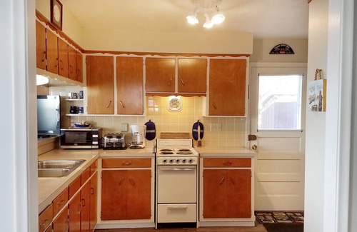 Gypsum House | Lake Front Nautical Themed Home with Private Yard & Sandy Bottom Water Access!