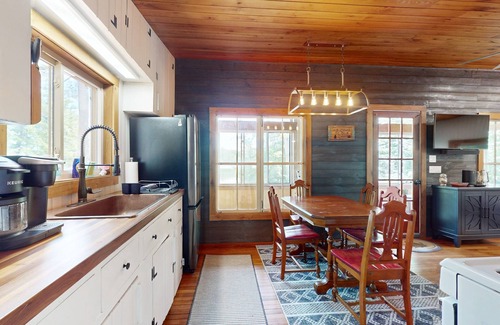 Wakefield House | Lakefront house with firepit, beach access, deck, grill, woodstove, & central AC