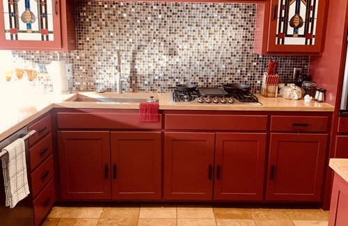 Springdale House | Lakeside house with fireplace, deck, and a fenced backyard with firepit.