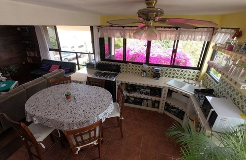 Mauricio Castro House | Large house on a hill with a spectacular view over the sea and mountains