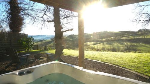 Llanfyllin House | Little Acorn - Luxury shepherd's hut/lodge with private hot tub and garden