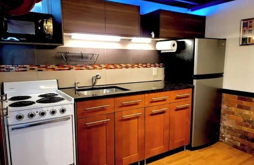 Blackstone Apartment | Live in this iconic East Side lower level apartment