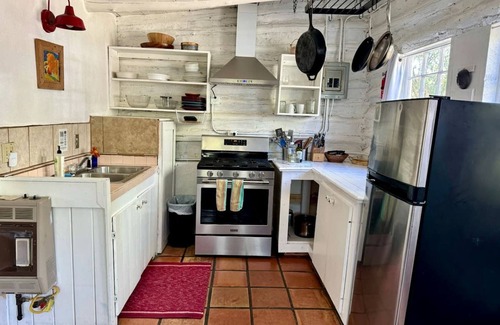 San Cristobal Cabin | Log Casita Overlooking Pond and Waterfall near Taos, New Mexico