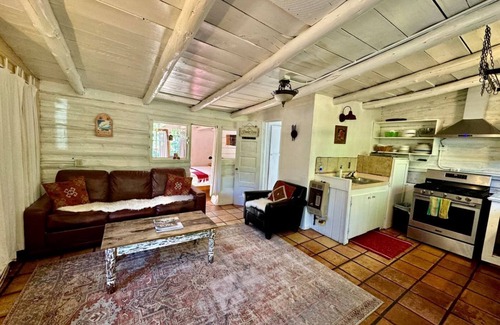San Cristobal Cabin | Log Casita Overlooking Pond and Waterfall near Taos, New Mexico
