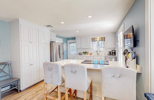 Cotuit House | Lovell's Pond Retreat - remodeled home with sunroom, steps to secluded pond