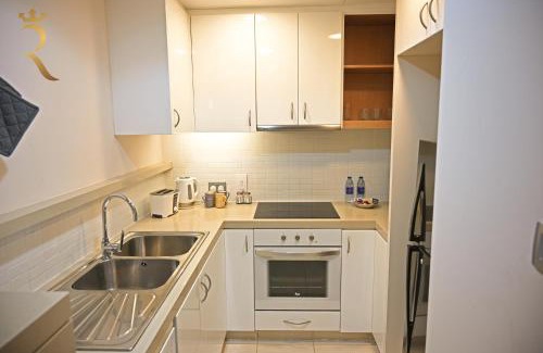 Al Raha Beach Apartment | Luna Breeze - Elegant 2BR Apartment with Beach Access, Near Al Raha Beach