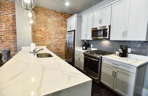 Central Business District Hotel | Luxurious Charm: Elegance with Exposed Brick Walls in New Orleans' CBD