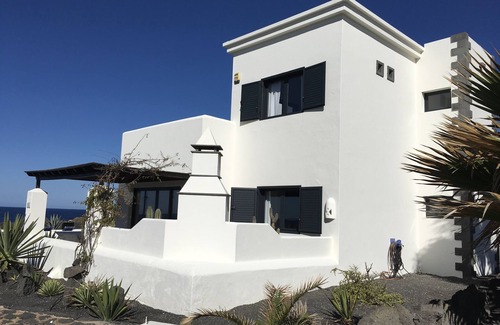Playa Blanca Villa | Luxury sea front villa with large private heated pool.