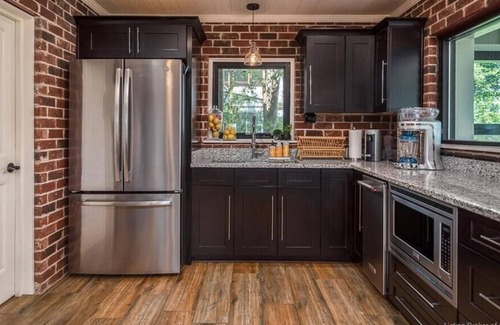 Otisco House | Luxury waterfront home. Fireplaces, patios & views