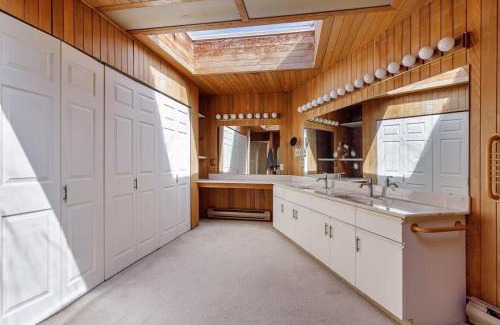 Ladner House | Master bedroom with spacious bathroom