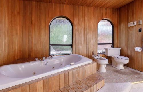 Ladner House | Master bedroom with spacious bathroom