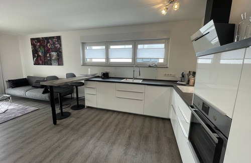 Losheim am See Apartment | Modern and centrally located holiday apartment with a large balcony.