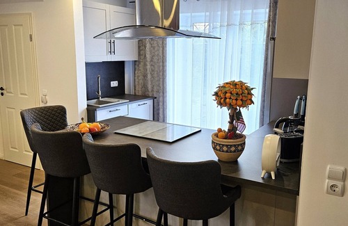 Midlum Apartment | Modern and cozy vacation apartment on the North Sea, rural, quiet, with garden