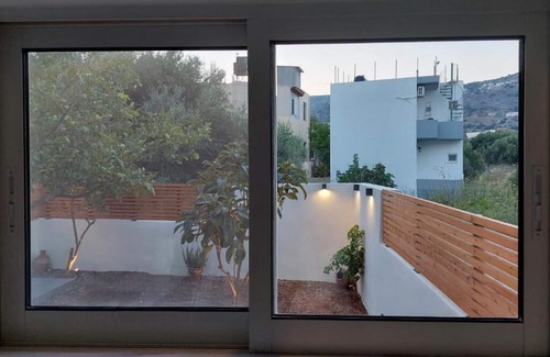 Mavrikiano Apartment | Modern apt with private garden next to the beach in the center of Elounda!