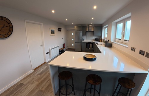 South Side House | Modern bungalow in a quiet lane in Guernsey. Private parking, private garden.