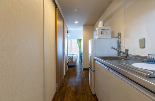 Onna Apartment | Mr.KINJO in front of Manza Beach