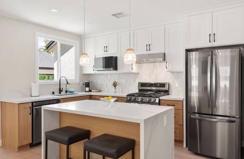 The Plaza House | *New* modern pool home + 5 mi to beach + sleeps 14