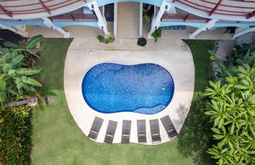 Potrero House | Newly Renovated Beachfront Condo with Inviting Minimalist Design, Pool & Balcony with Ocean Views